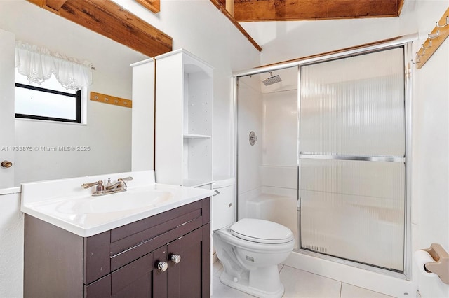 bathroom featuring vanity, toilet, tile patterned flooring, and a shower with door