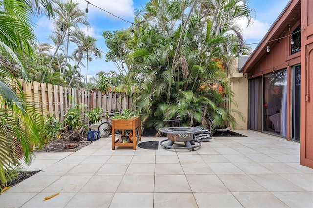 view of patio / terrace featuring a fire pit