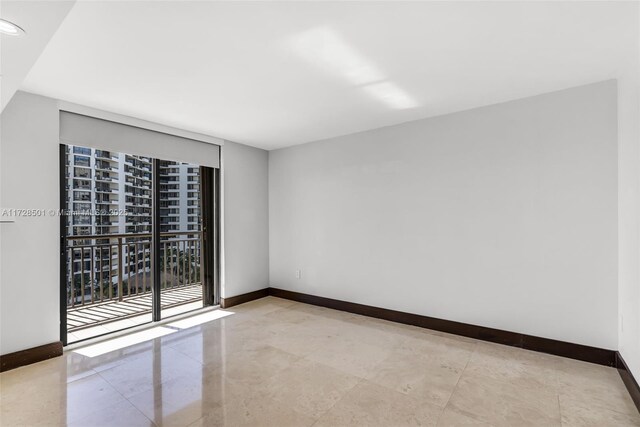 540 Brickell Key Dr Unit 1021, Miami, FL 33131 - spare room featuring baseboards and recessed lighting