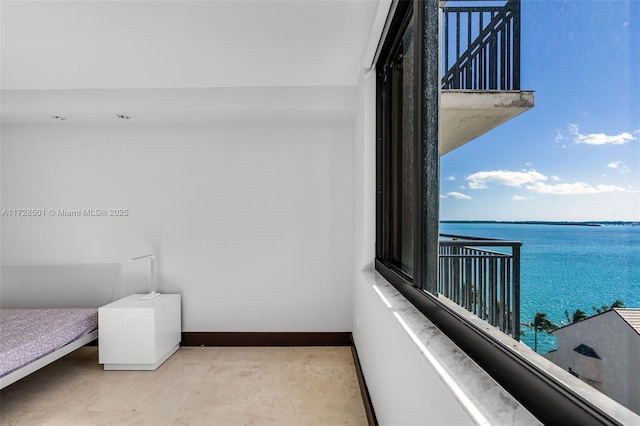 balcony featuring a water view