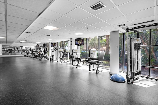 540 Brickell Key Dr Unit 1021, Miami, FL 33131 - gym with expansive windows and a paneled ceiling