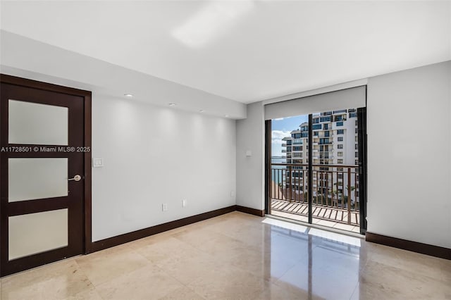 unfurnished room featuring floor to ceiling windows