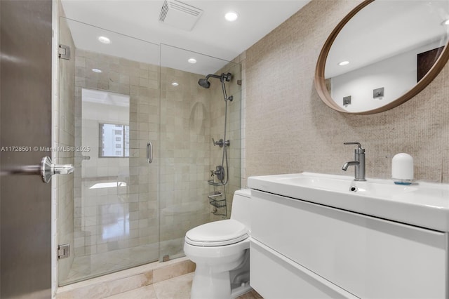 bathroom featuring walk in shower, tile patterned floors, vanity, and toilet