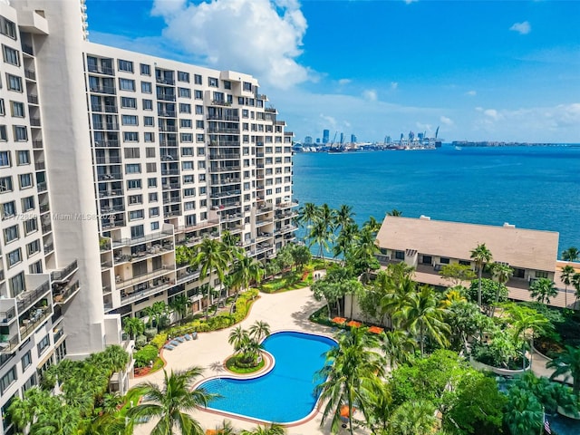 view of pool with a water view