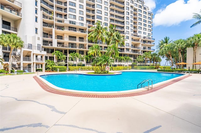 view of swimming pool featuring a patio area