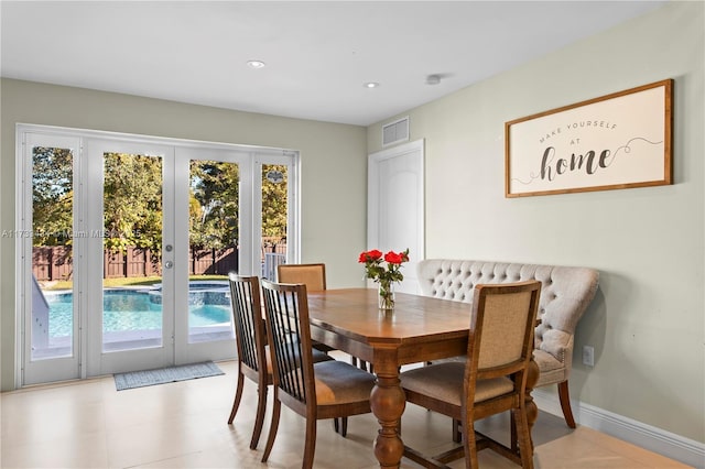 dining space with a wealth of natural light and french doors