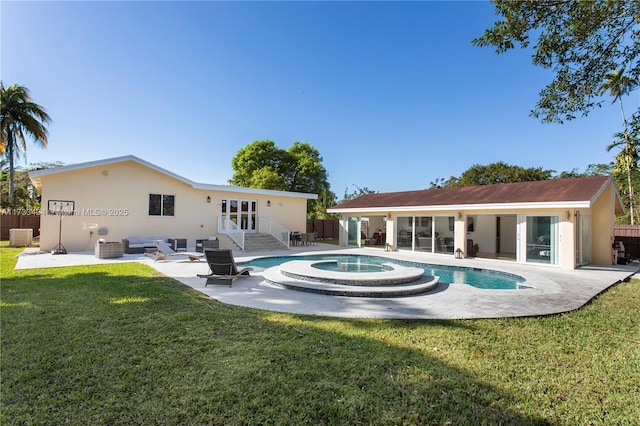 back of property with a lawn, a patio area, central air condition unit, a pool with hot tub, and an outdoor hangout area