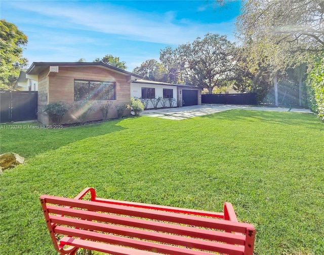 view of yard featuring a garage