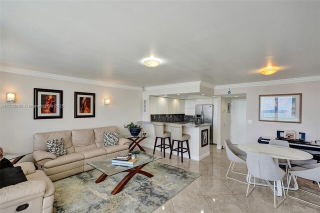 living room with ornamental molding and marble finish floor