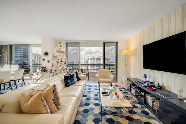 living room featuring plenty of natural light and floor to ceiling windows