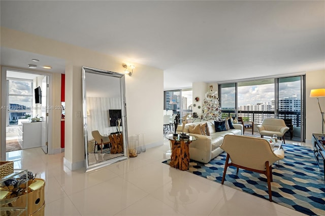 tiled living room featuring floor to ceiling windows