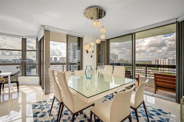 dining room featuring light tile patterned floors and floor to ceiling windows