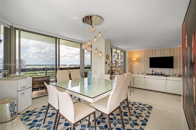 dining space with a wall of windows