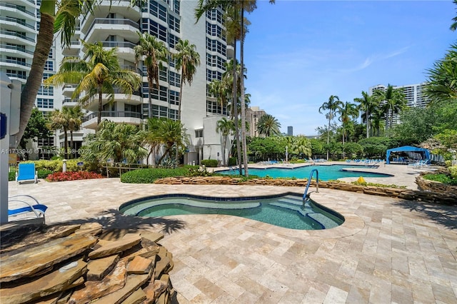 view of swimming pool with a patio