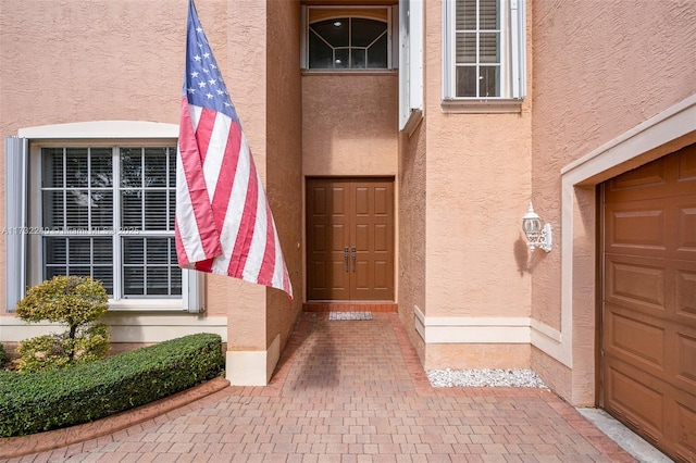 property entrance with a garage