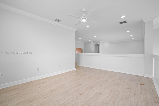 unfurnished room with crown molding, light hardwood / wood-style flooring, and ceiling fan