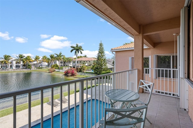 balcony featuring a water view