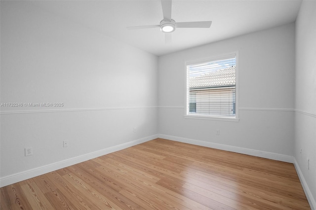 spare room with light hardwood / wood-style flooring and ceiling fan