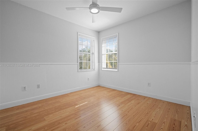 unfurnished room featuring light hardwood / wood-style floors and ceiling fan