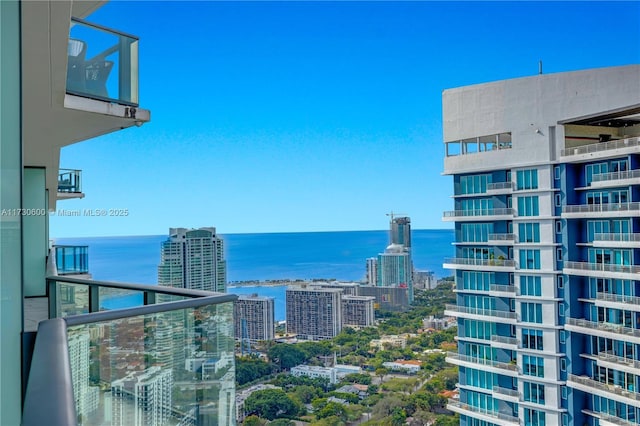 balcony featuring a water view