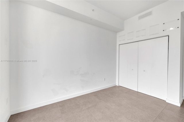 unfurnished bedroom with a closet