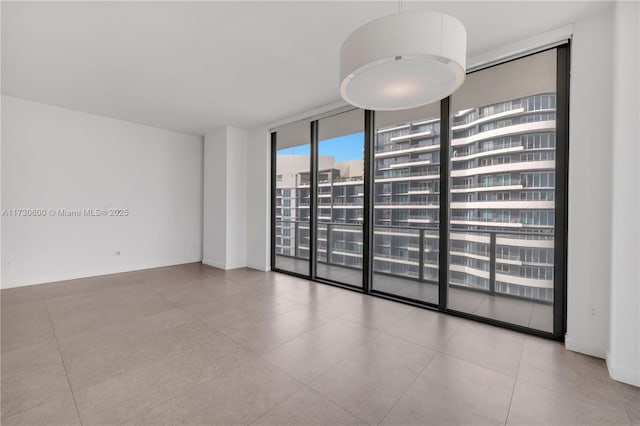 spare room with expansive windows