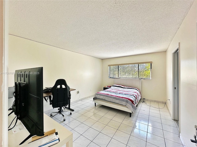 tiled bedroom with a textured ceiling