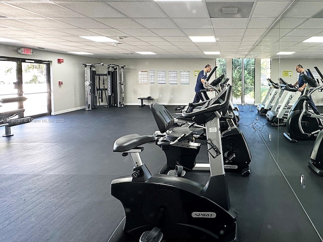 workout area featuring a drop ceiling