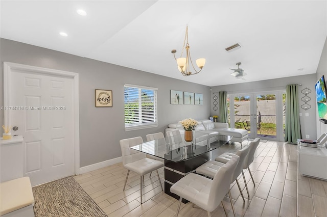 dining room with french doors, plenty of natural light, and a notable chandelier