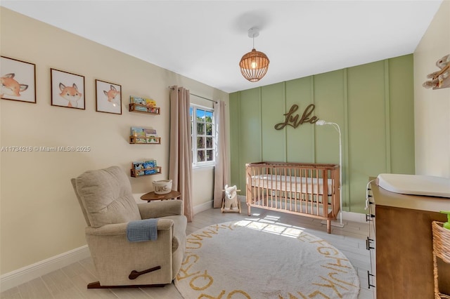 bedroom with a nursery area