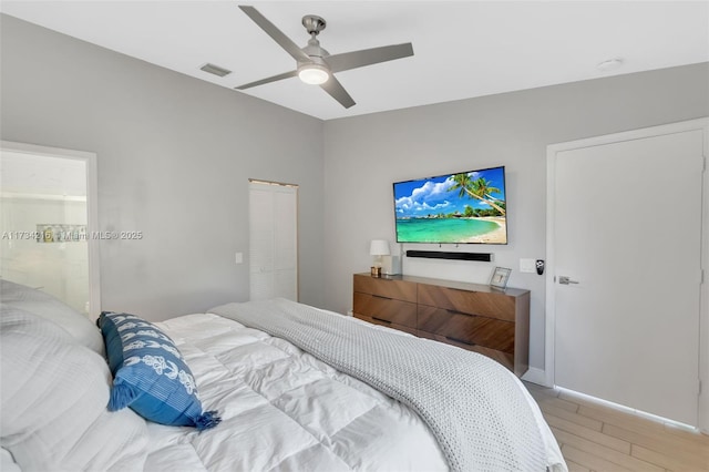 bedroom with wood-type flooring and ceiling fan