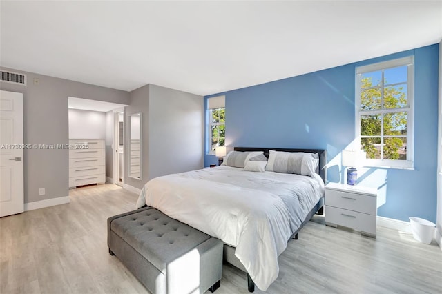 bedroom with light hardwood / wood-style flooring