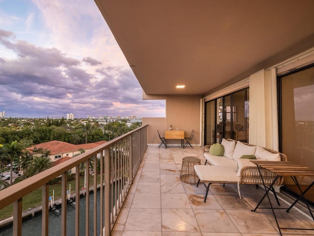 view of balcony at dusk