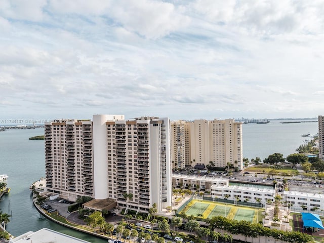 birds eye view of property featuring a view of city and a water view