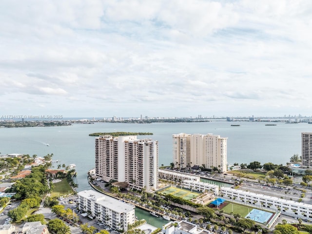 birds eye view of property with a city view and a water view