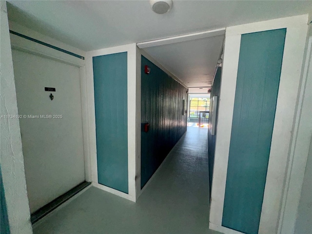 corridor featuring concrete floors