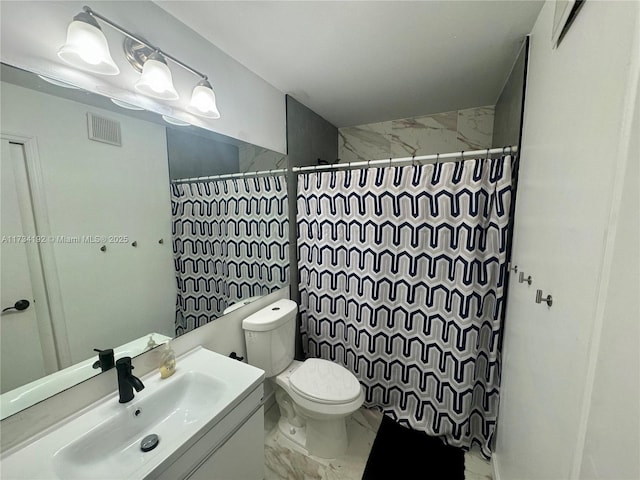 bathroom with vanity, toilet, and a shower with shower curtain