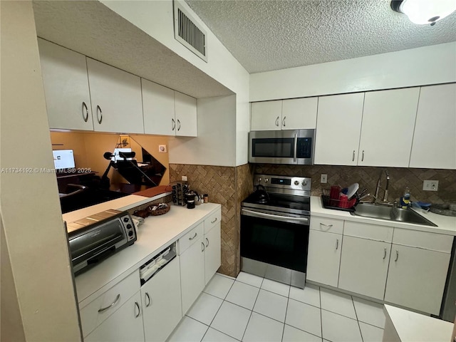 kitchen featuring white cabinetry, sink, and stainless steel appliances