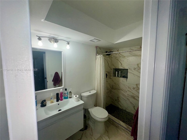 bathroom with vanity, toilet, and walk in shower