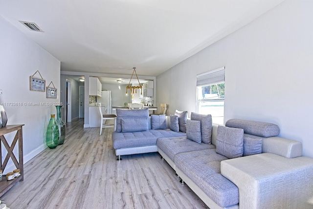 living room with light hardwood / wood-style flooring