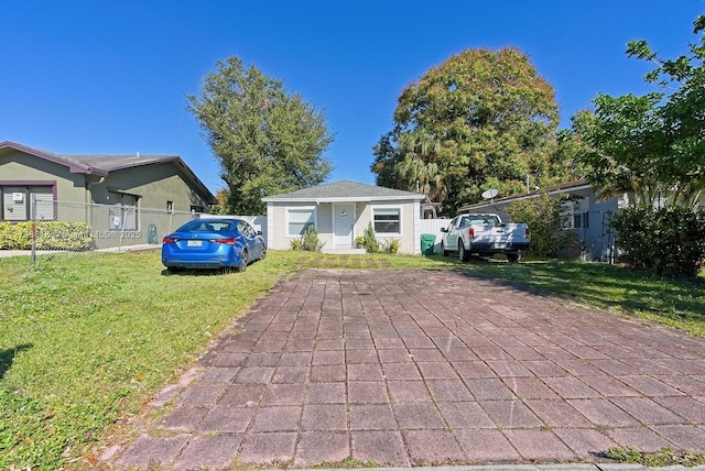 bungalow with a front lawn