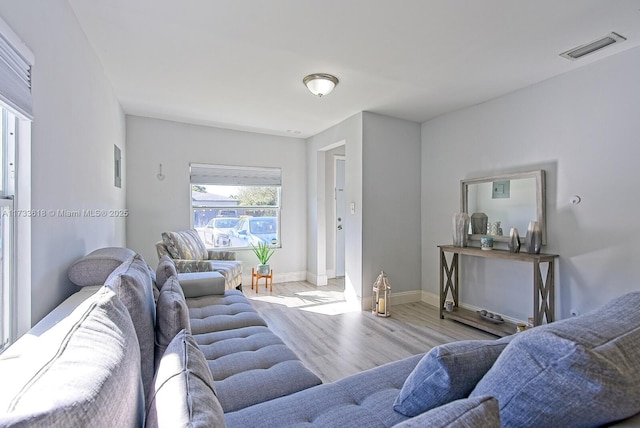 living room with light hardwood / wood-style flooring