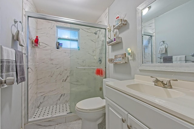 bathroom with vanity, toilet, and walk in shower