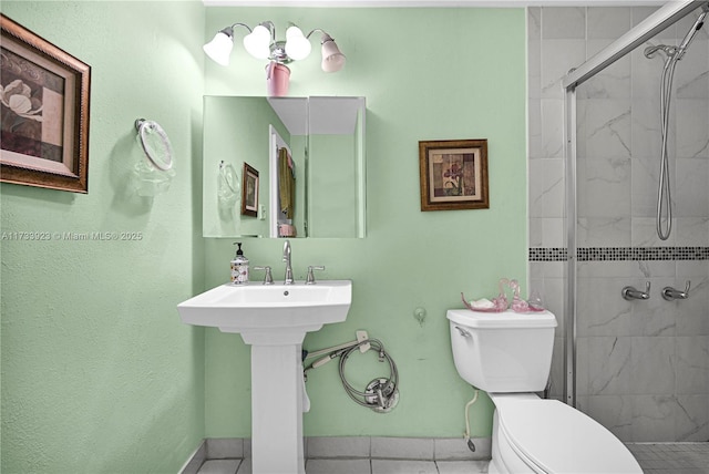 bathroom with toilet, a shower with shower door, and tile patterned flooring