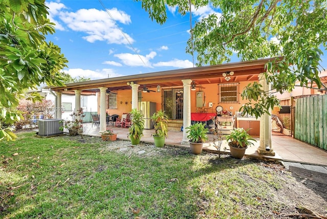 back of property with a patio, central AC, ceiling fan, and a lawn