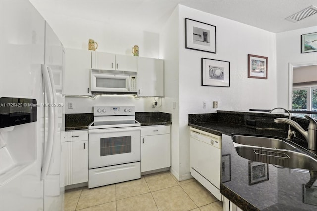 13114 SW 44th St Unit 2204, Miramar, FL 33027 - kitchen with white appliances, a sink, light tile patterned flooring, and white cabinets