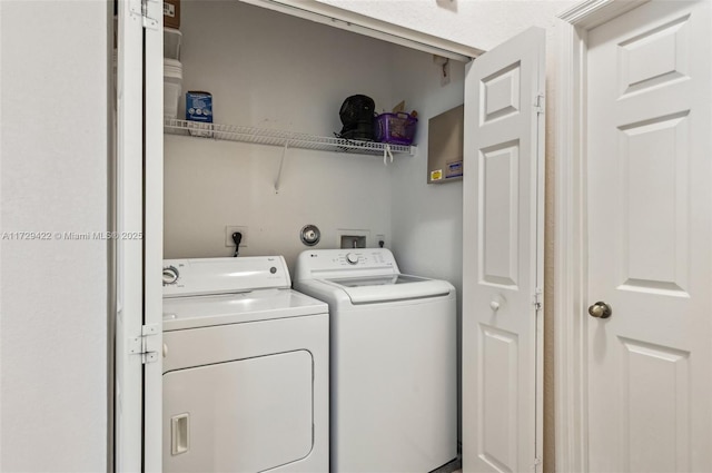 laundry area with washer and clothes dryer