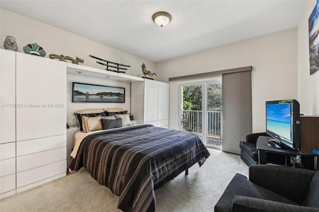 bedroom featuring light carpet and access to outside