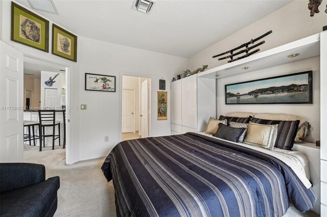 bedroom with light colored carpet