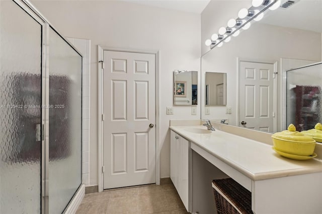 13114 SW 44th St Unit 2204, Miramar, FL 33027 - bathroom featuring a stall shower, tile patterned flooring, and vanity